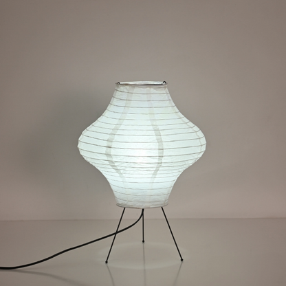 Paper Desk Lamp, Diamond Shape, with light bulb inside on stand.