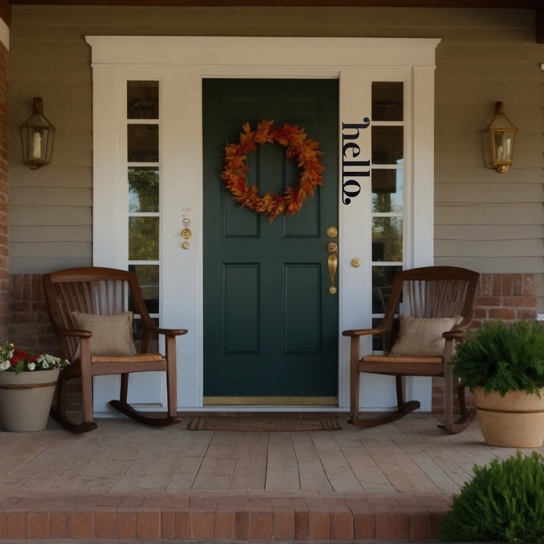 Black metal "hello" entry door sign with fall wreath, rocking chairs, and lanterns.
