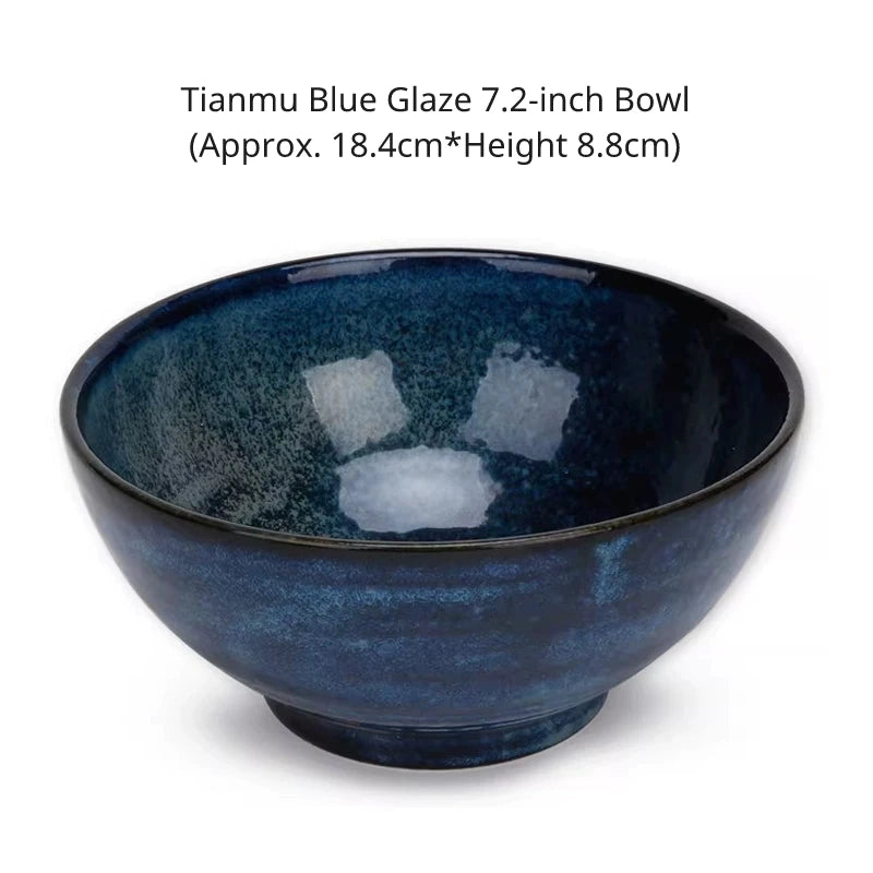Close-up of a large, wide 7.2-inch noodle/soup bowl in a deep, vibrant speckled blue glaze, isolated on white.