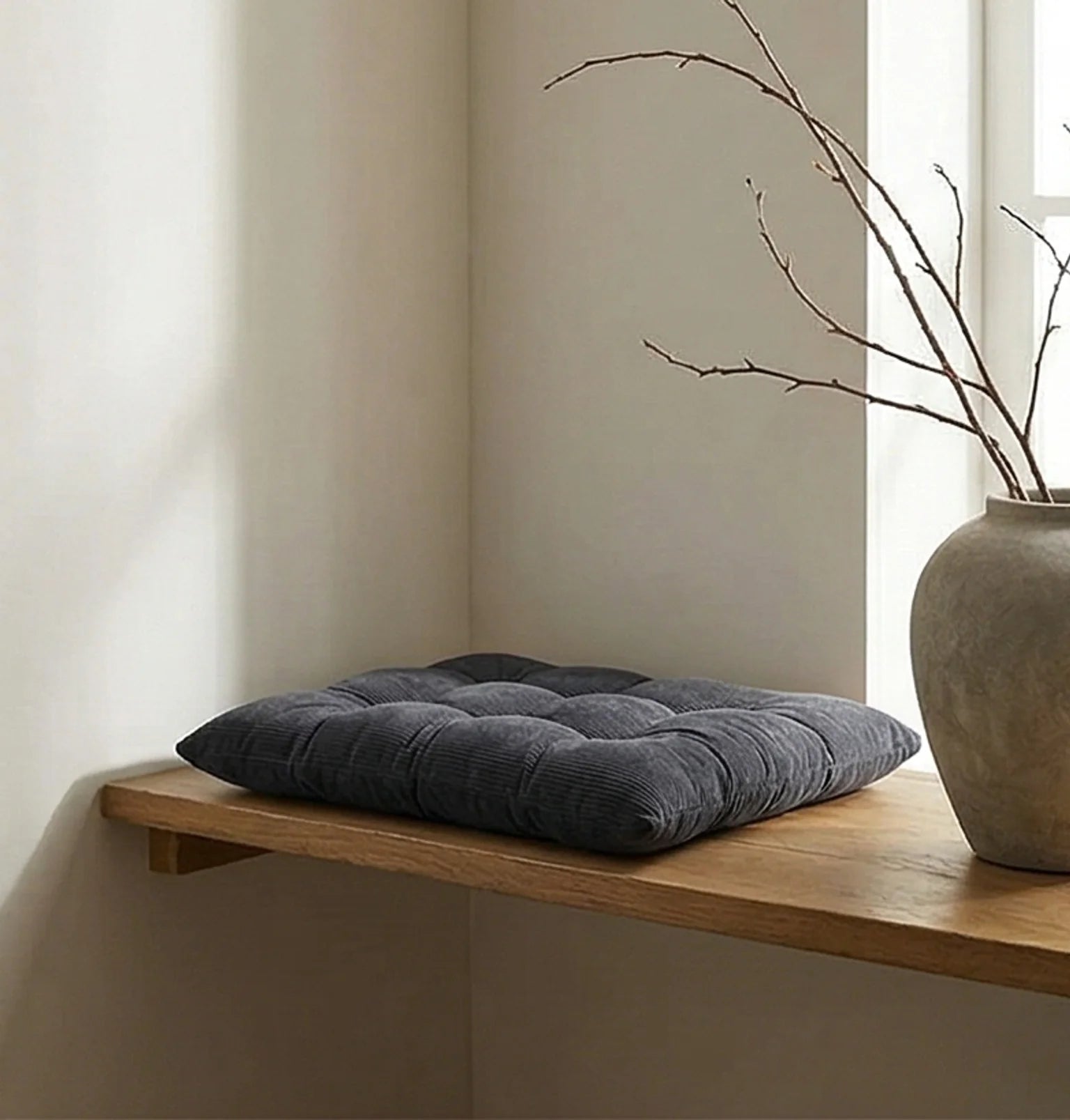 Corduroy Tufted Floor Cushion with Anti-Slip Bottom — ambient room context on shelf in soft natural light
