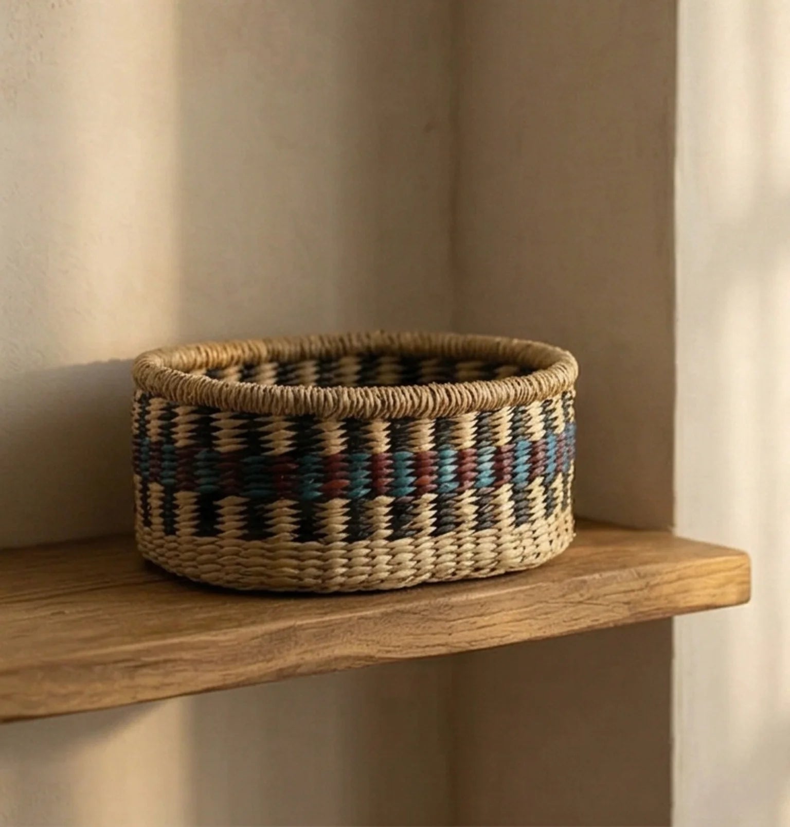 Hand-Woven Sea Grass Storage Baskets - Natural & Colorful — ambient room context on shelf in soft natural light