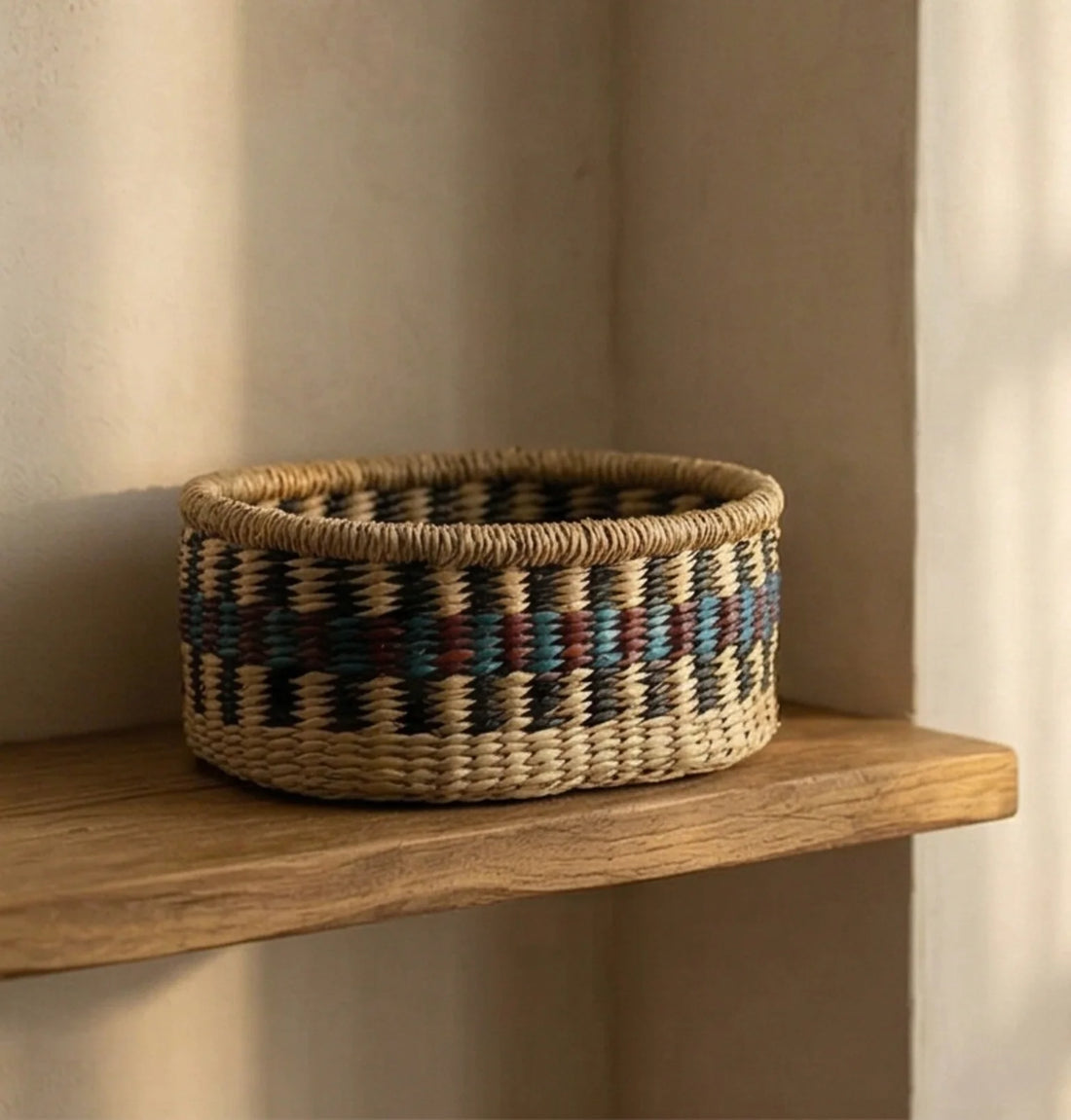 Hand-Woven Sea Grass Storage Baskets - Natural & Colorful — ambient room context on shelf in soft natural light