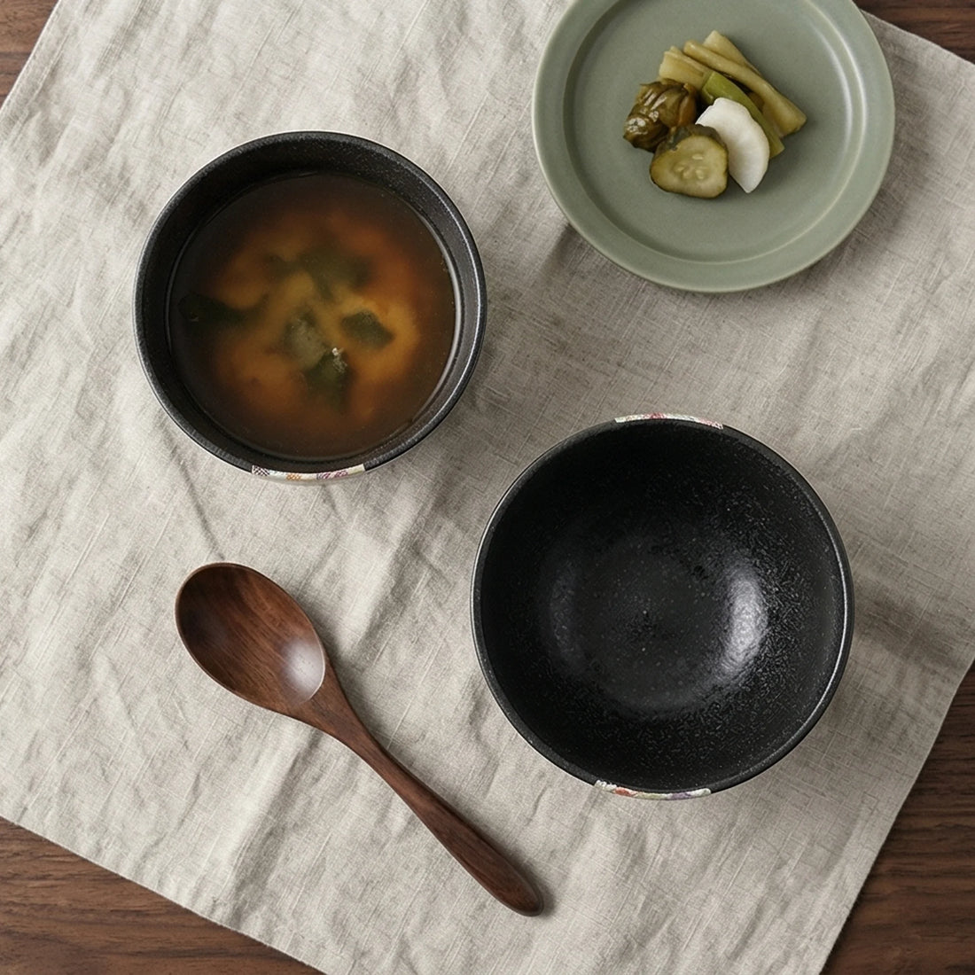 Japanese Style Jian Zhan Oil-Dripping Tenmoku Ceramic Rice Bowl with Washi Decal — overhead flat-lay on linen surface