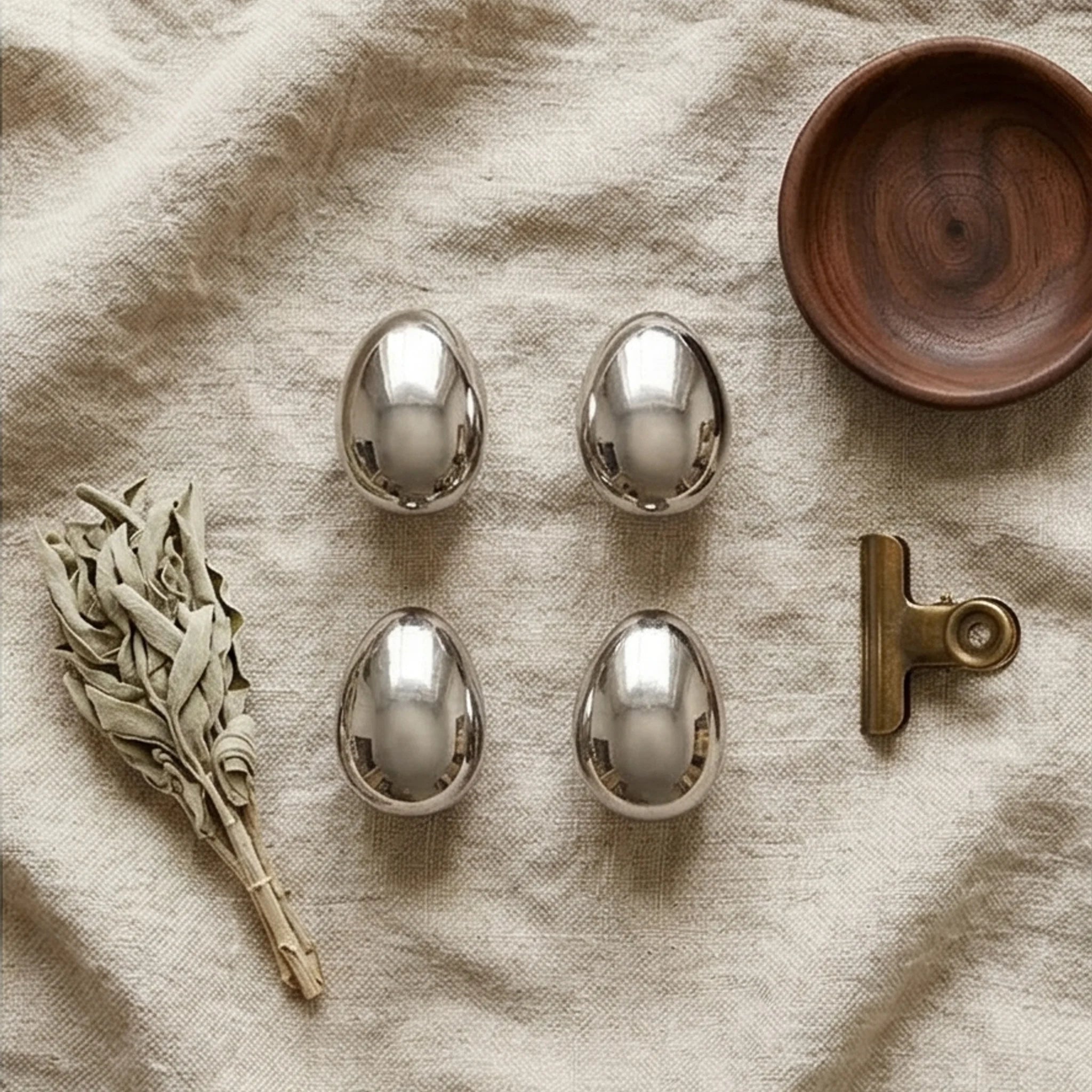 MINILUXE Modern Silver Water Drop Wall Hooks - Ceramic Electroplated Coat Hangers — overhead flat-lay on linen surface