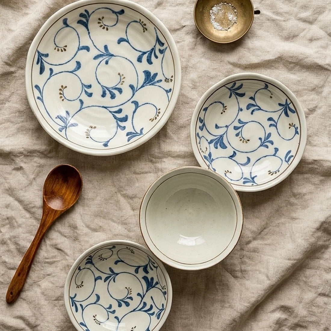 Japanese Style Jin Tang Cao Ceramic Dinnerware Set - Underglaze Blue Pattern — overhead flat-lay on linen surface