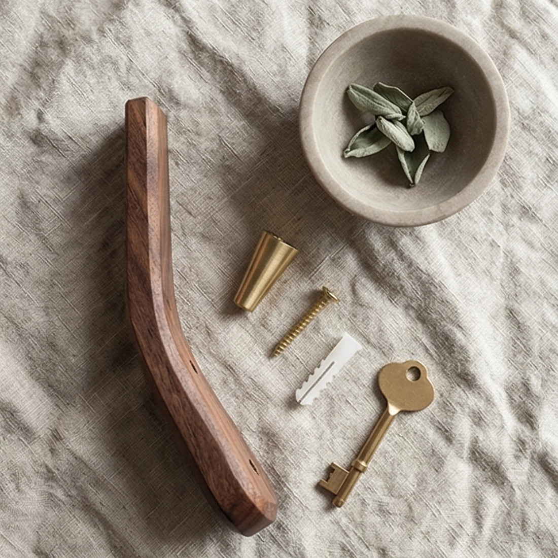Solid Wood Moon-Shaped Wall Hook with Brass Fittings for Coat and Keys — overhead flat-lay on linen surface