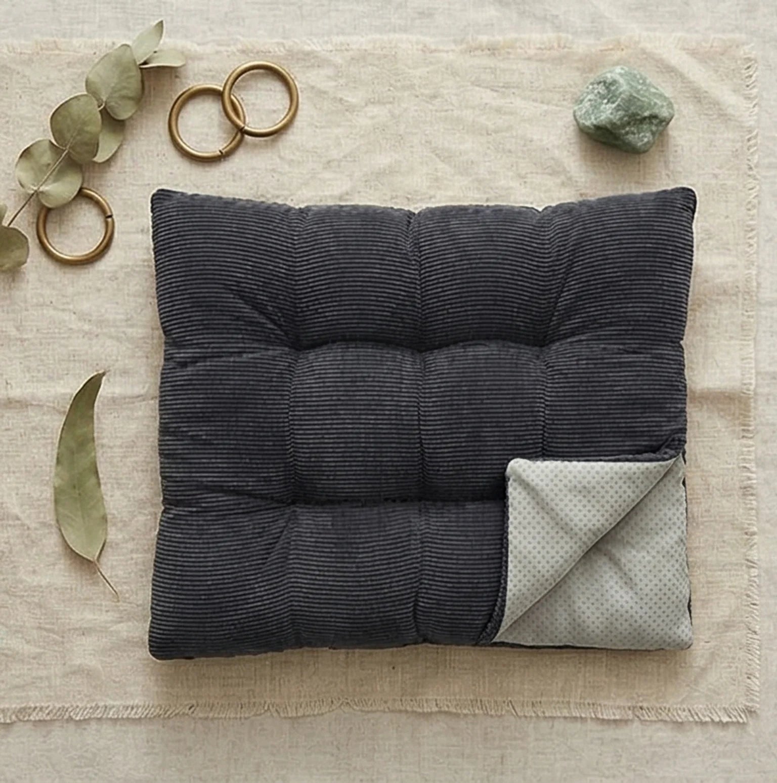 Corduroy Tufted Floor Cushion with Anti-Slip Bottom — overhead flat-lay on undyed linen surface