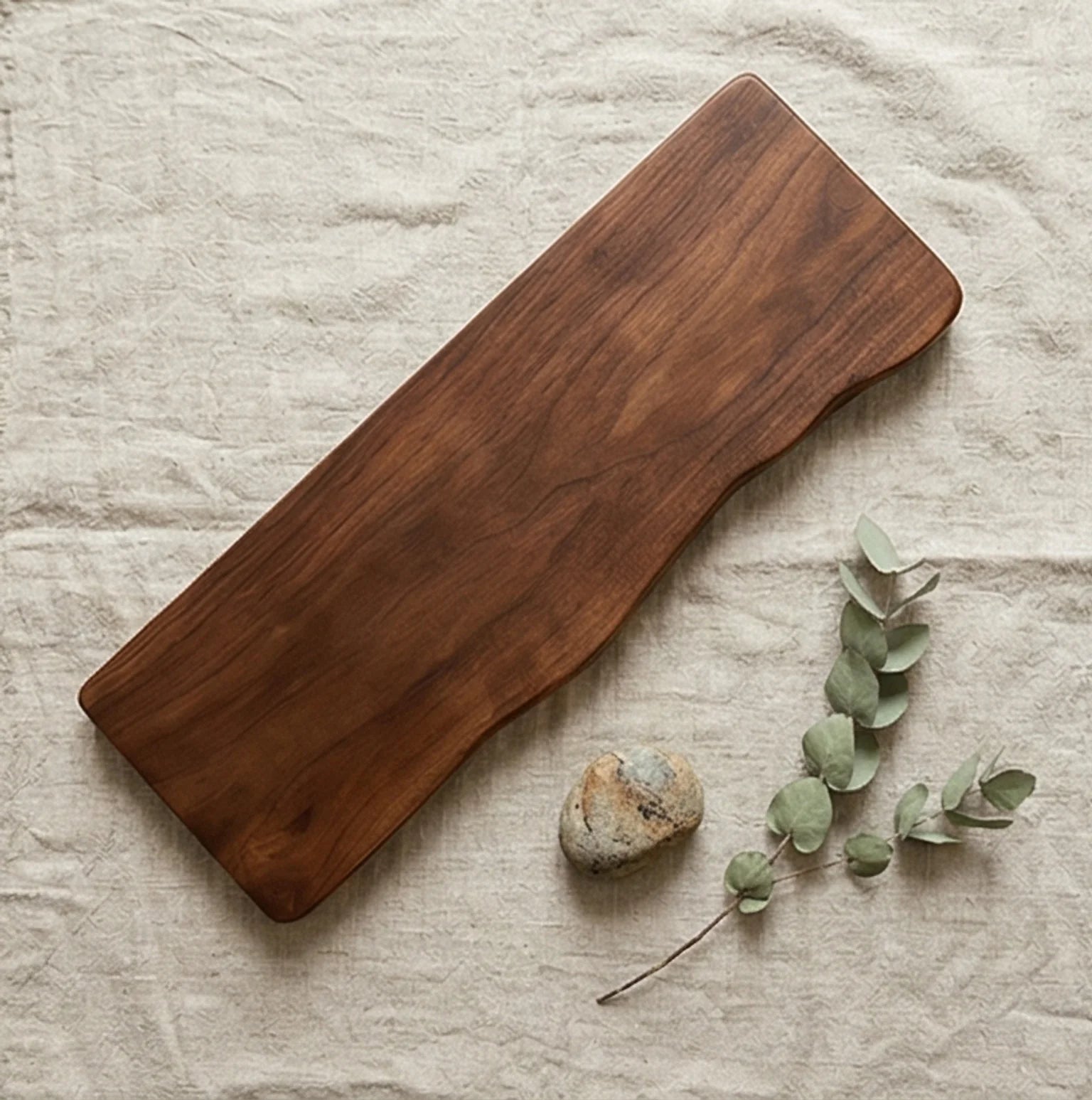 Solid Wood Floating Wall Shelf with Natural Irregular Edge — overhead flat-lay on undyed linen surface