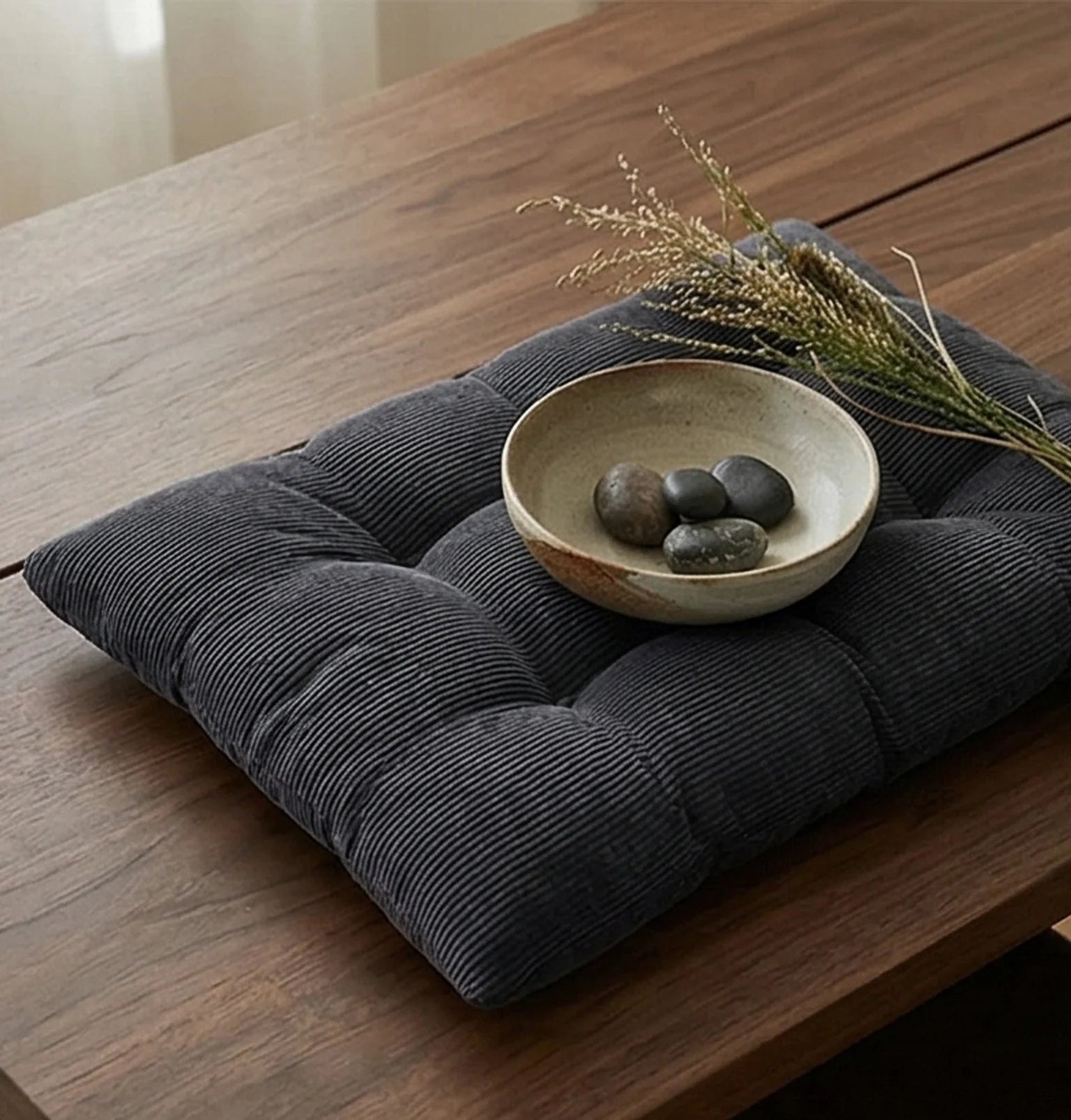 Corduroy Tufted Floor Cushion with Anti-Slip Bottom — lifestyle dining or shelf scene with natural props