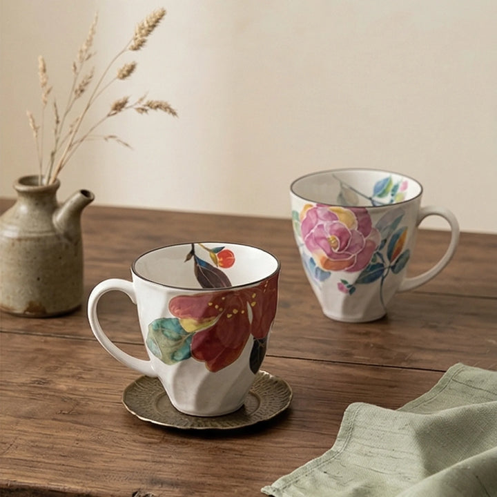 Artistic Floral Ceramic Mug - Underglaze Hand-Painted Style Mug with Unique Faceted Body — lifestyle dining table scene with natural props