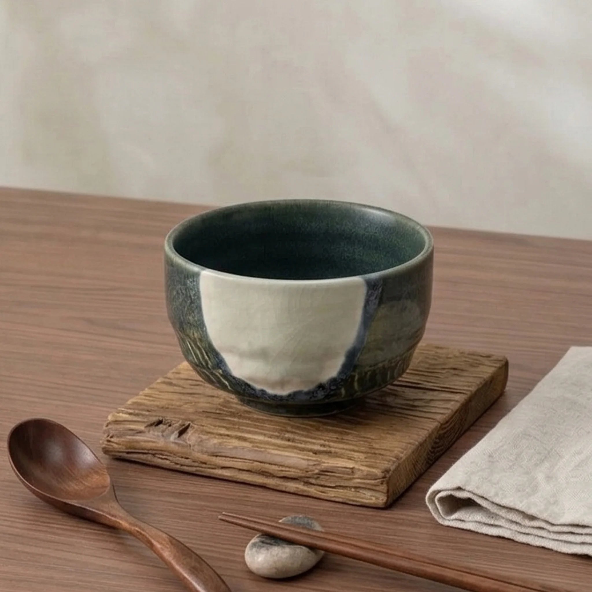 Artisan Japanese Ceramic Matcha Tea Bowl - Glazed Stoneware with Dynamic Glaze (Mei Yan Kiln Style) — lifestyle dining table scene with natural props