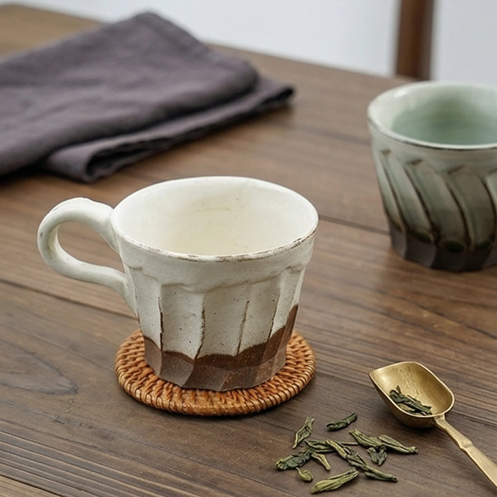Handcrafted Japanese Ceramic Coffee Cups - Fluted Design, Artisan Glazes (Crane Gray, Peacock Blue, Fairy White) — lifestyle dining table scene with natural props