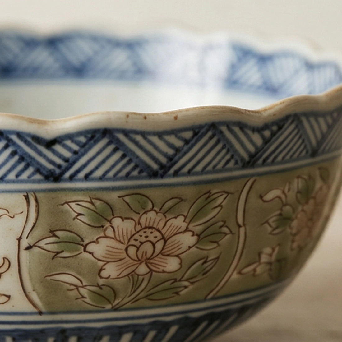 Authentic Japanese Imari Porcelain Rice Bowls Set (5 Pcs) - Scalloped Edge, Hand-Painted Floral — macro close-up of ceramic glaze texture and finish