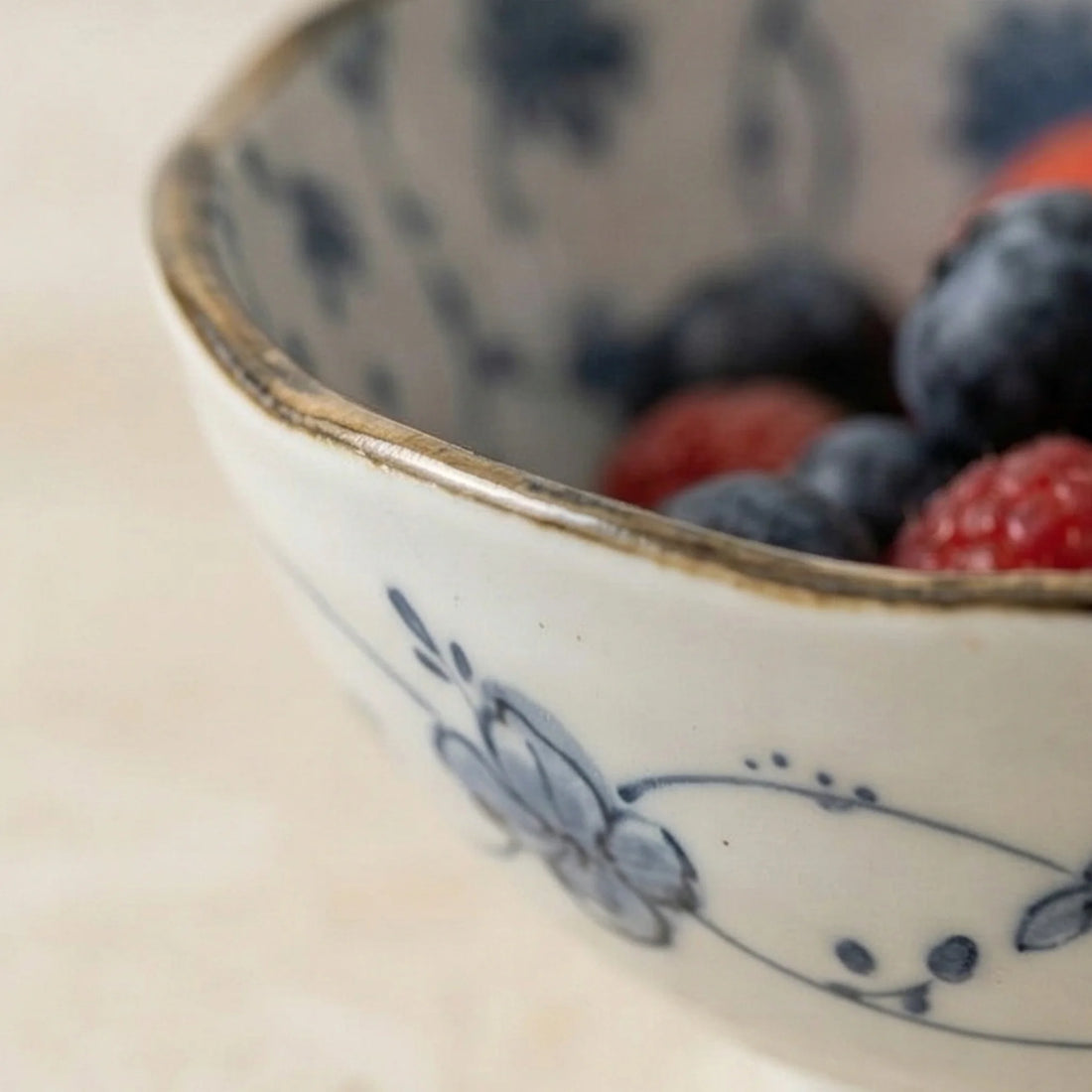 Japanese Style Blue & White Porcelain Dinnerware Set - Underglaze Tang Grass Pattern — macro close-up of ceramic glaze texture and finish