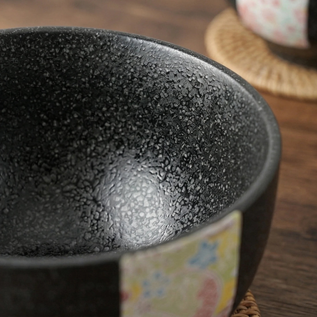 Japanese Style Jian Zhan Oil-Dripping Tenmoku Ceramic Rice Bowl with Washi Decal — macro close-up of ceramic glaze texture and finish