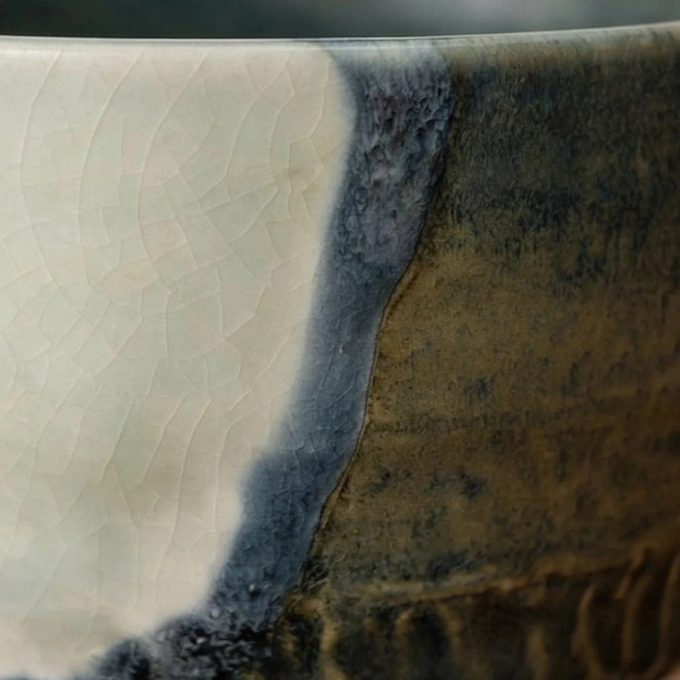 Artisan Japanese Ceramic Matcha Tea Bowl - Glazed Stoneware with Dynamic Glaze (Mei Yan Kiln Style) — macro close-up of ceramic glaze texture and finish