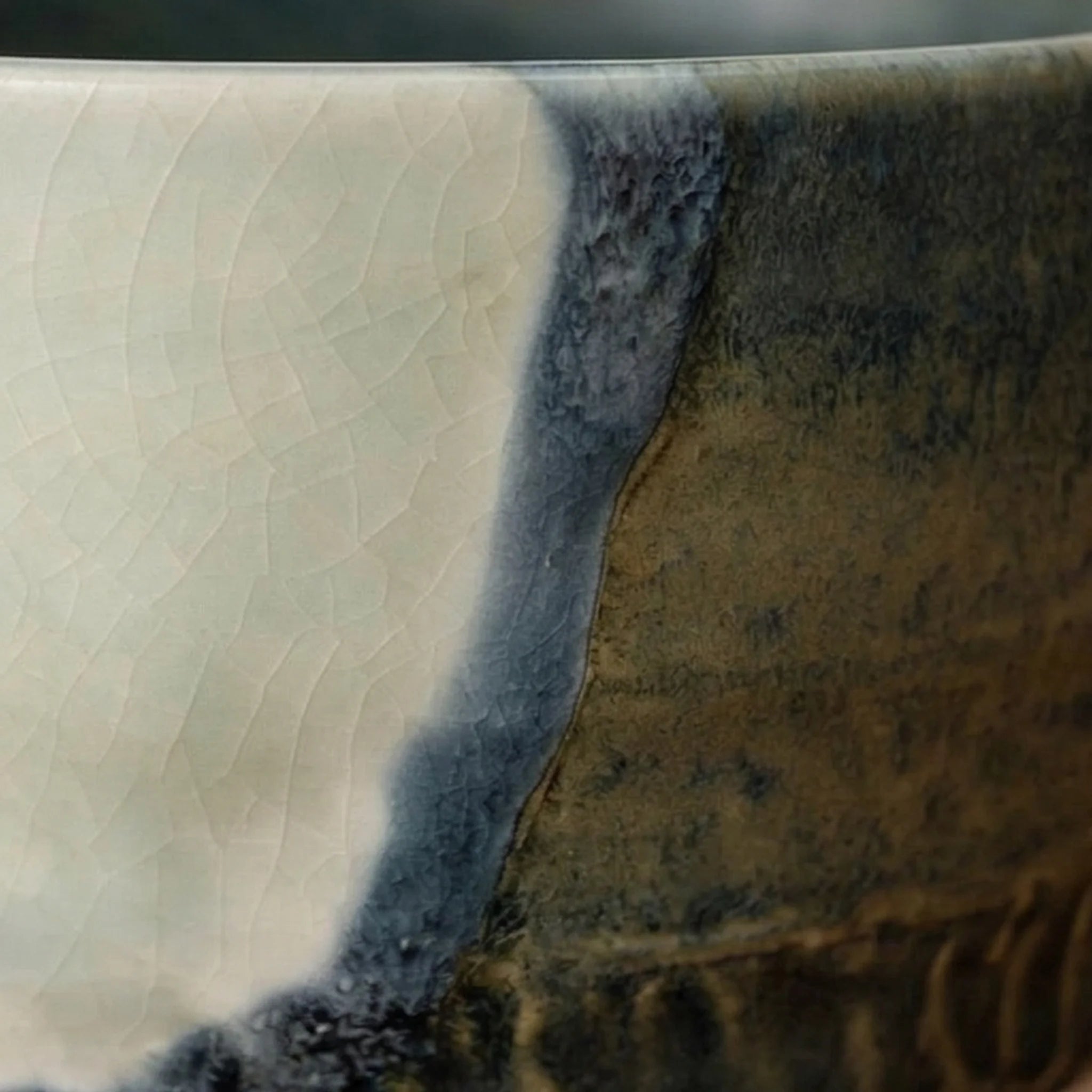 Artisan Japanese Ceramic Matcha Tea Bowl - Glazed Stoneware with Dynamic Glaze (Mei Yan Kiln Style) — macro close-up of ceramic glaze texture and finish