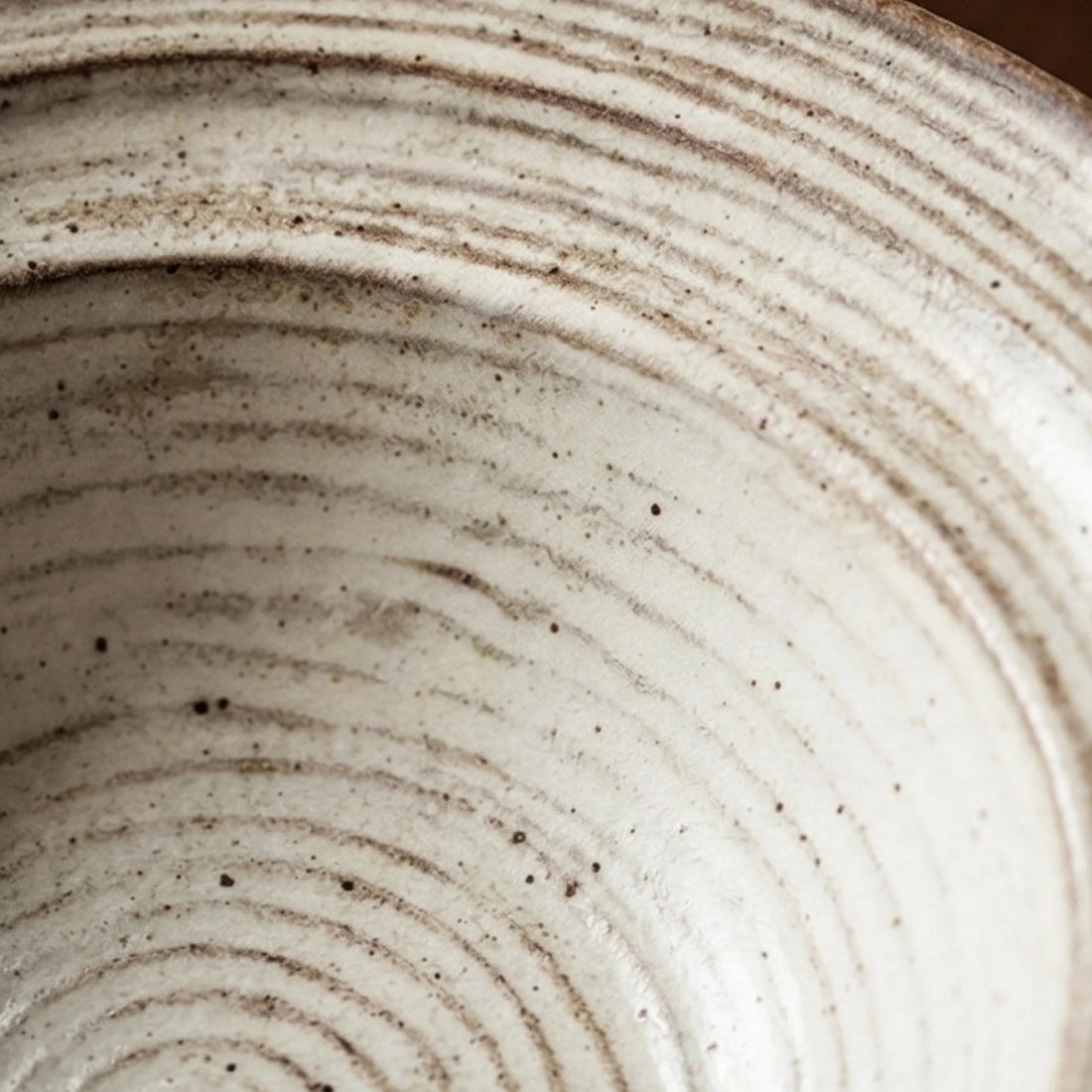 Rustic Handmade Ceramic Bowl with Spiral Texture - Jingdezhen Pottery Dinnerware — macro close-up of ceramic glaze texture and finish