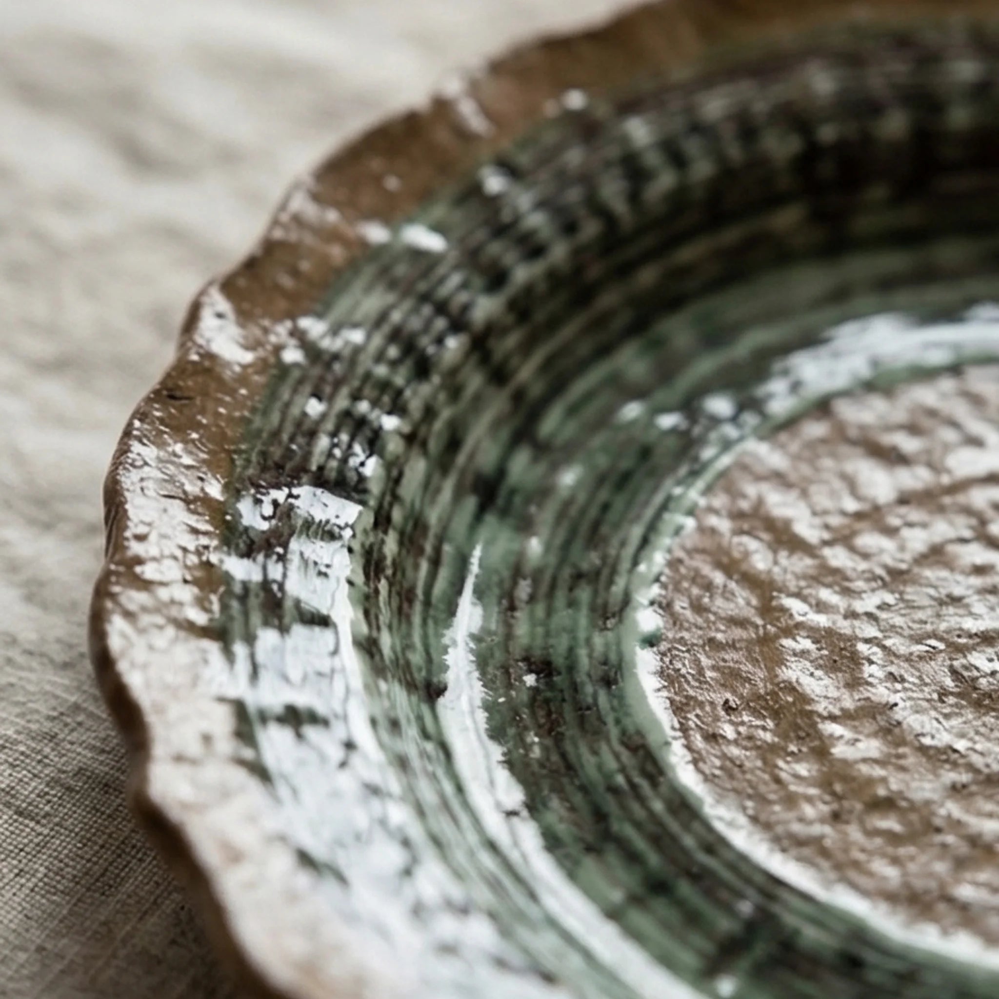 Artisan Handmade Ceramic Dinnerware Set - Rustic Pottery Bowls and Plates with Glaze — macro close-up of ceramic glaze texture and finish
