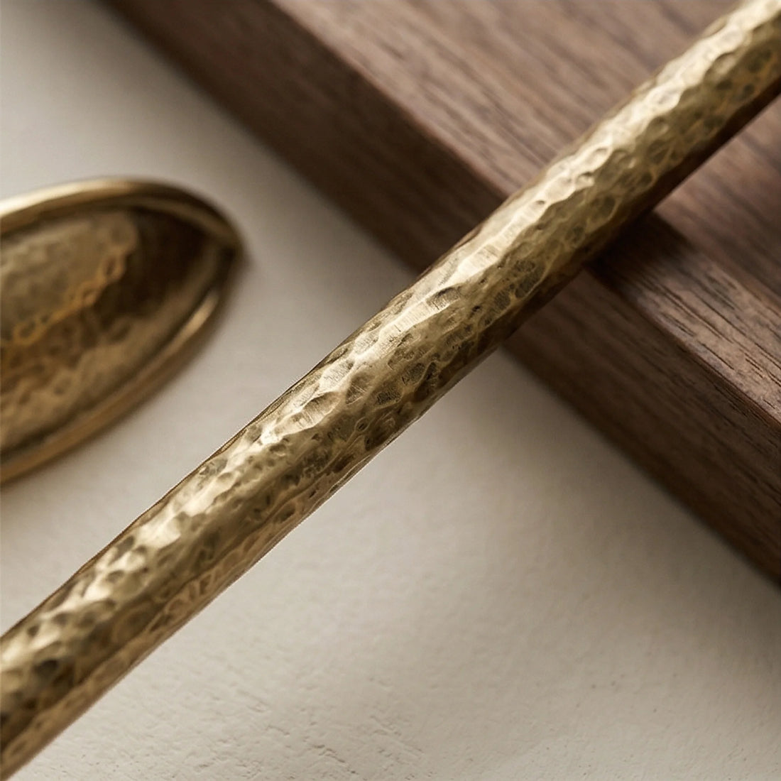 Handmade Hammered Brass Cabinet Pulls and Knobs - Luxury Gold Drawer Handles — macro close-up of ceramic glaze texture and finish