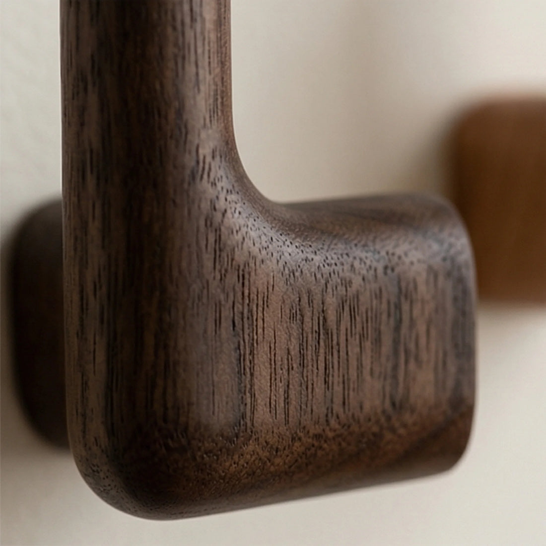 Solid Wood Wall Hook for Coats and Curtain Straps — macro close-up of ceramic glaze texture and finish