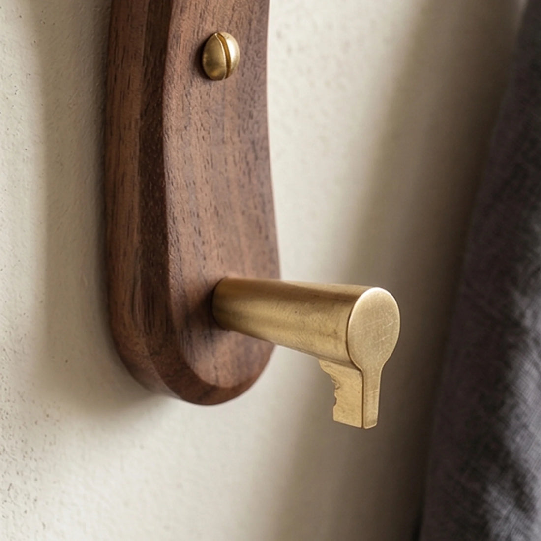 Solid Wood Moon-Shaped Wall Hook with Brass Fittings for Coat and Keys — macro close-up of ceramic glaze texture and finish