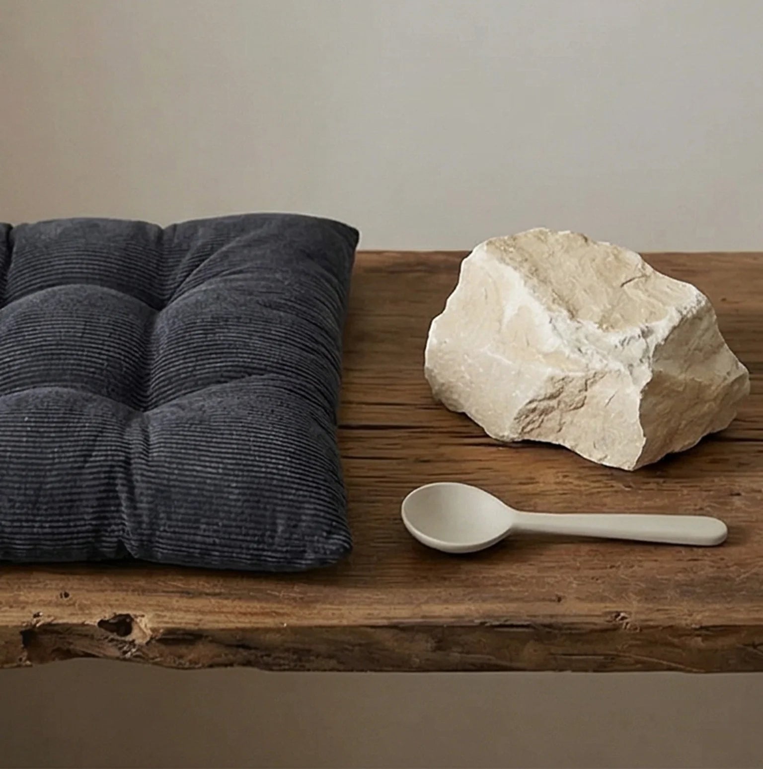 Corduroy Tufted Floor Cushion with Anti-Slip Bottom — scale reference alongside natural prop