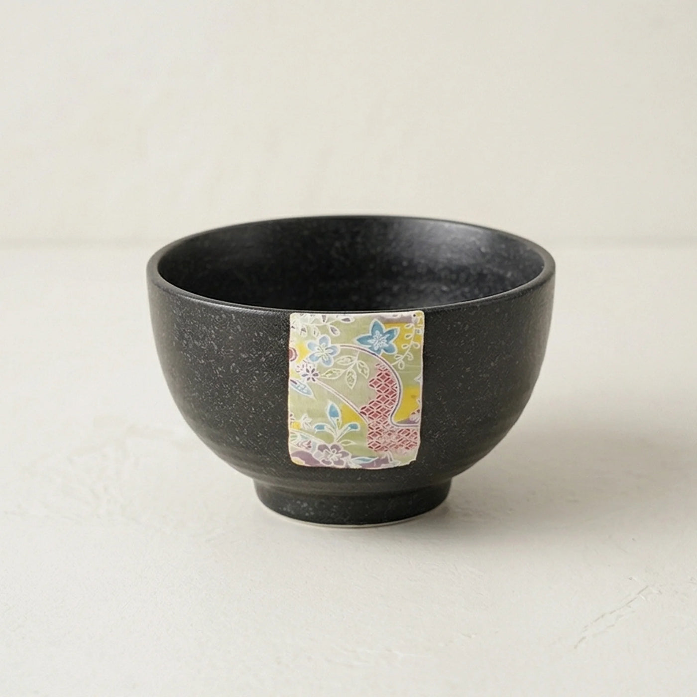 Japanese Style Jian Zhan Oil-Dripping Tenmoku Ceramic Rice Bowl with Washi Decal — studio white background product shot