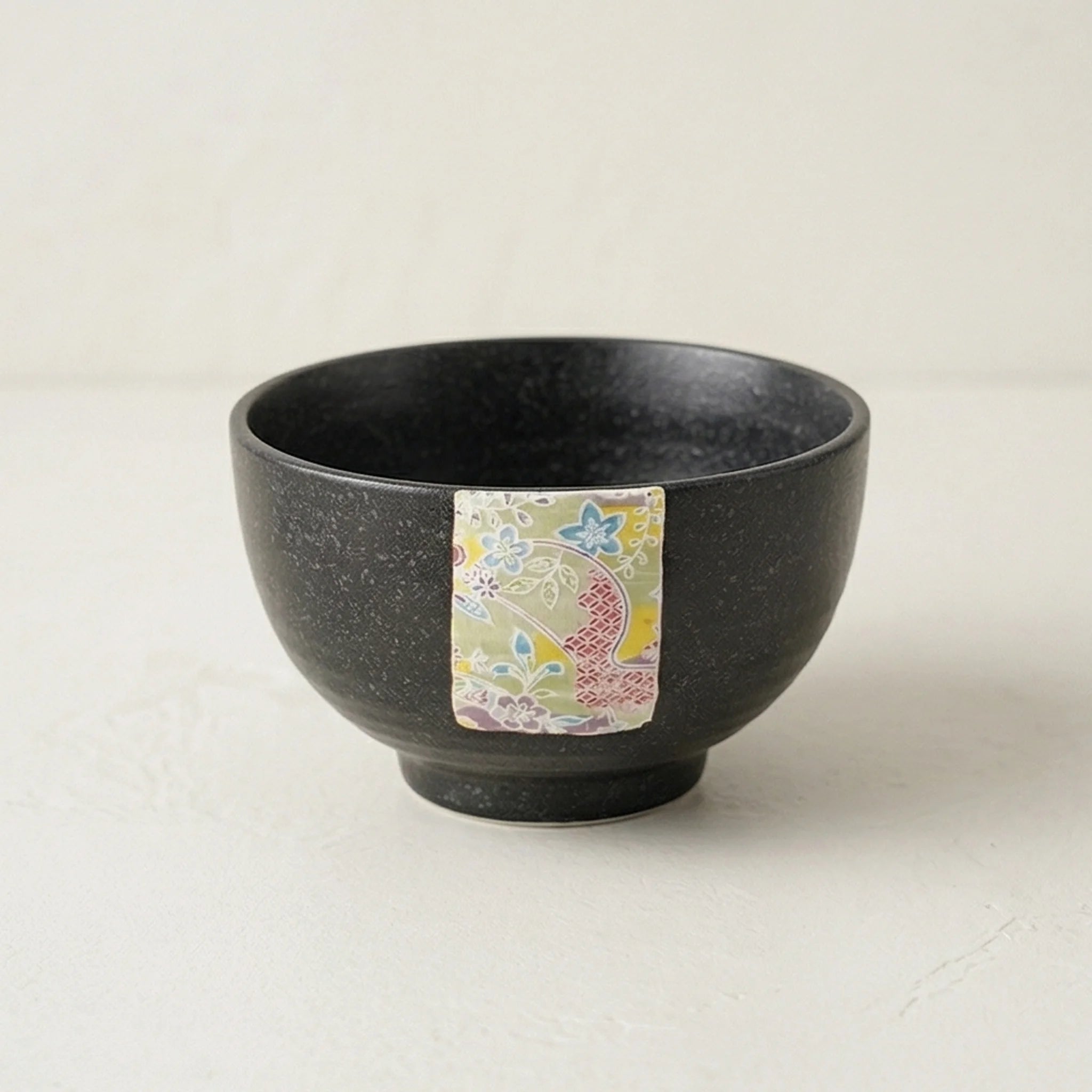 Japanese Style Jian Zhan Oil-Dripping Tenmoku Ceramic Rice Bowl with Washi Decal — studio white background product shot