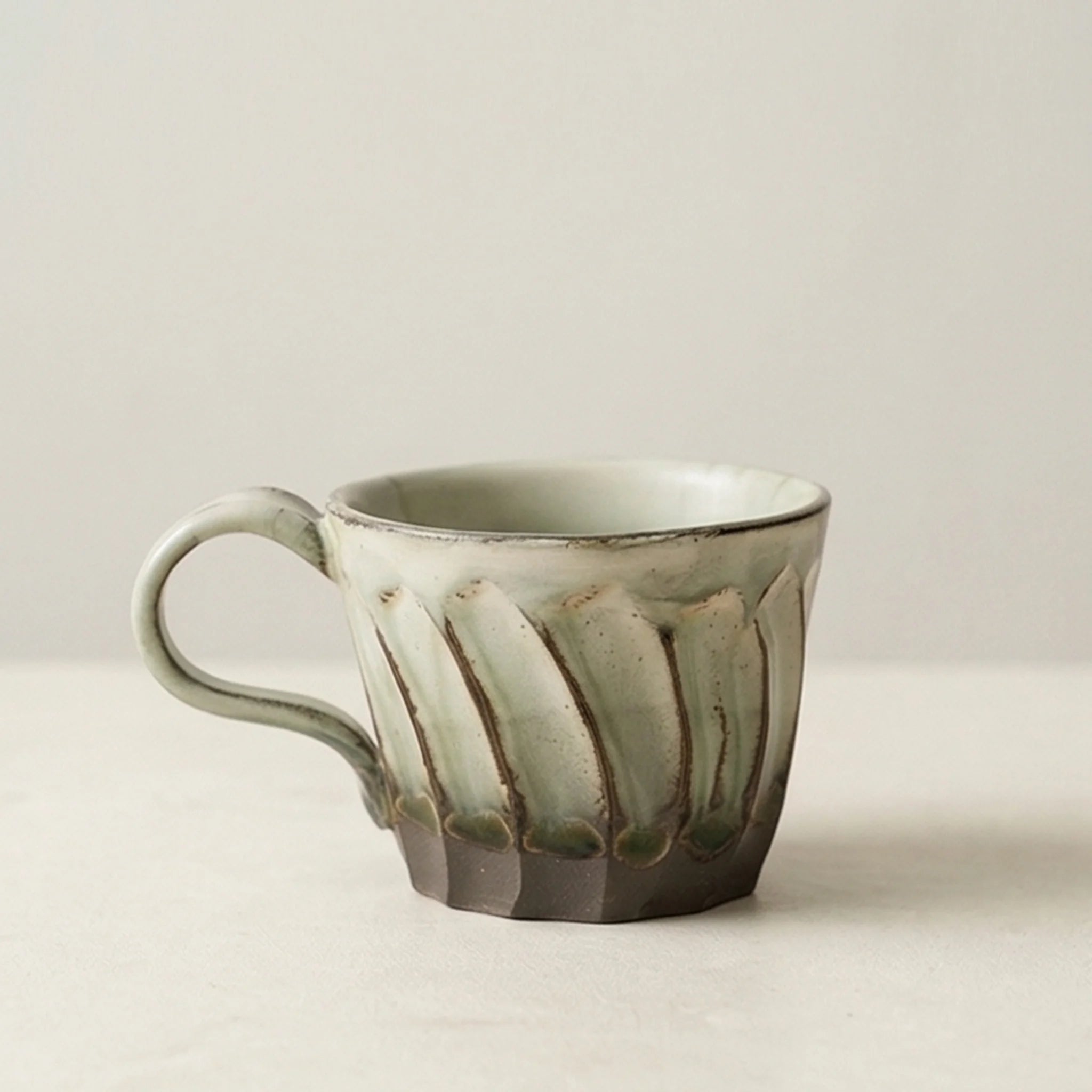 Handcrafted Japanese Ceramic Coffee Cups - Fluted Design, Artisan Glazes (Crane Gray, Peacock Blue, Fairy White) — studio white background product shot
