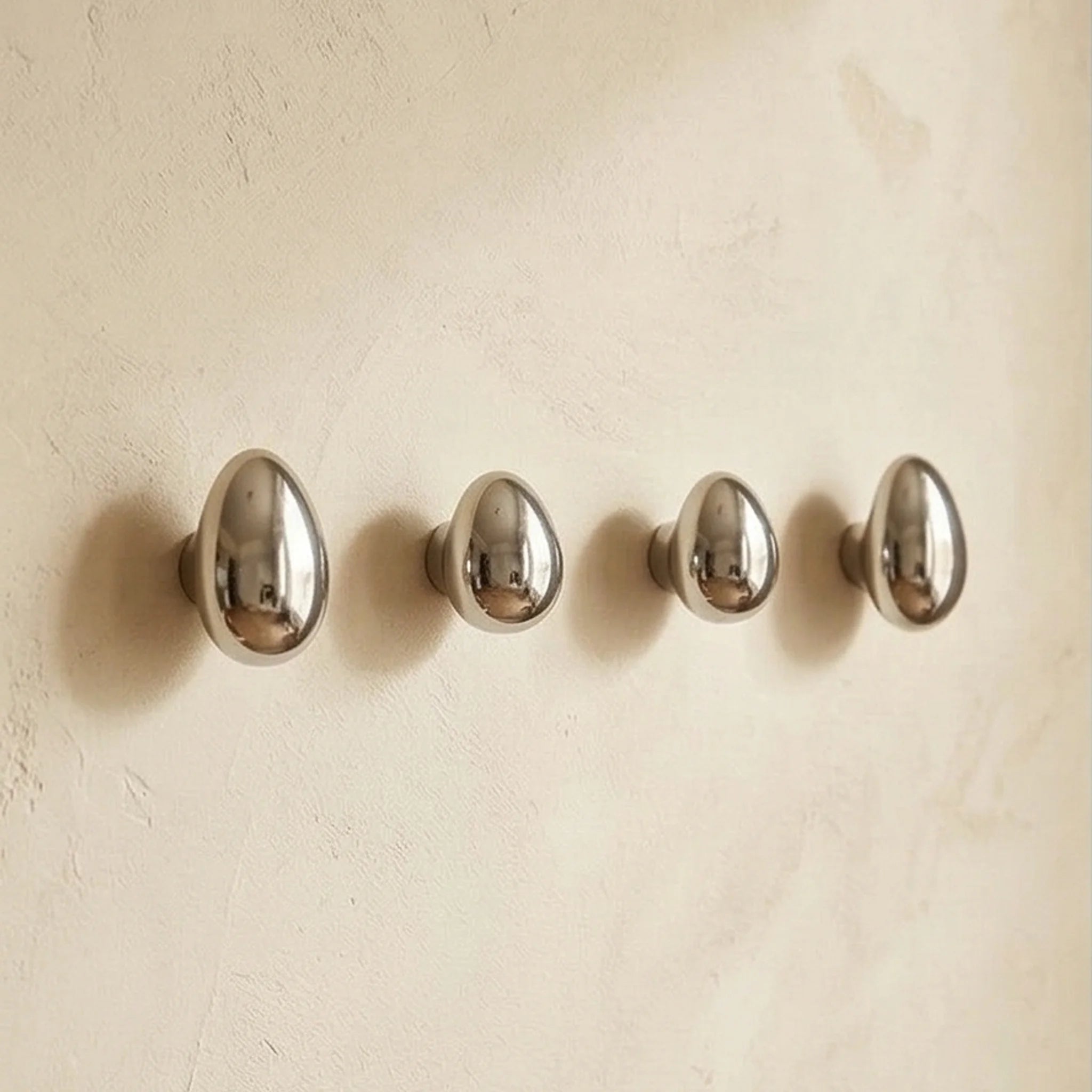 MINILUXE Modern Silver Water Drop Wall Hooks - Ceramic Electroplated Coat Hangers — studio white background product shot