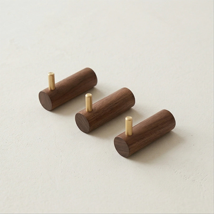 Solid Wood Walnut Wall Hook with Brass Peg for Headphone or Coat Hanging — studio white background product shot