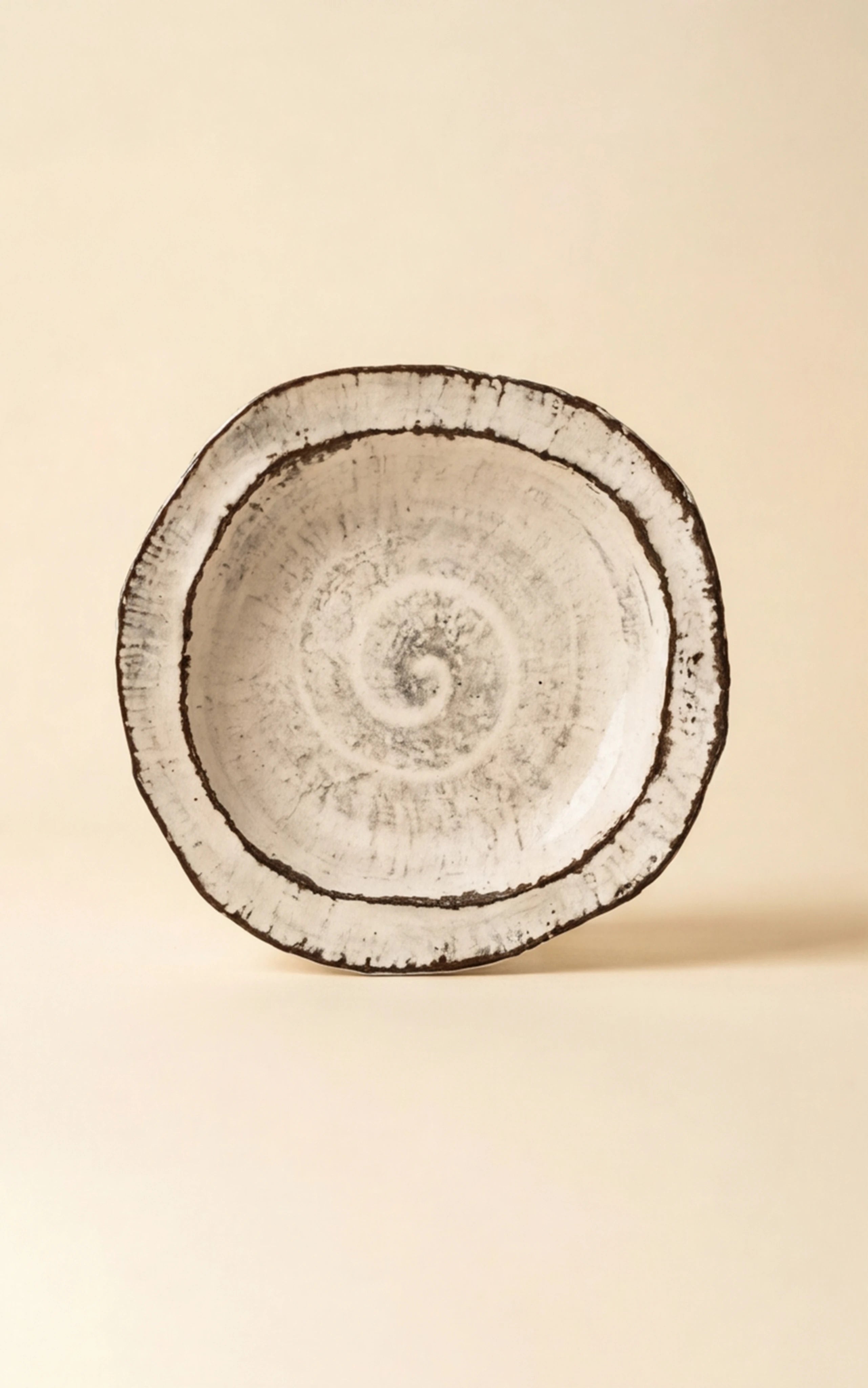 Handmade Irregular Ceramic Plate | Japanese Style Rustic Pottery Dish (19x18cm) — clean studio front shot on warm parchment background (v4 refined)
