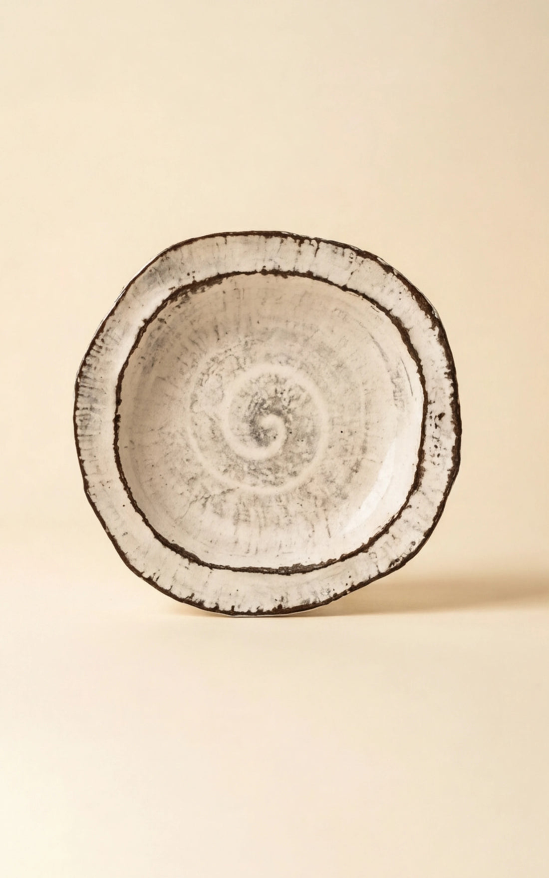 Handmade Irregular Ceramic Plate | Japanese Style Rustic Pottery Dish (19x18cm) — clean studio front shot on warm parchment background (v4 refined)