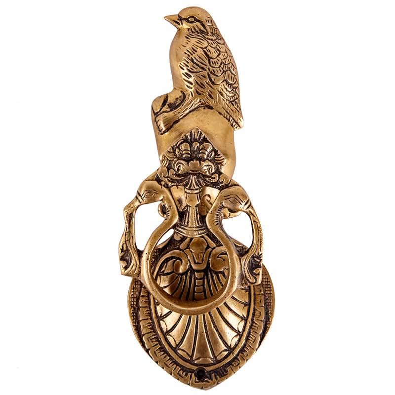 Handmade brass door knocker with bird design and ornate details. Home decor.