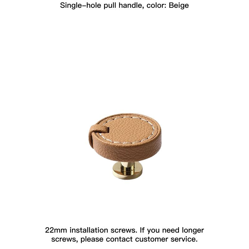 Beige round decorative leather drawer pull with gold base, part of Home Decor.