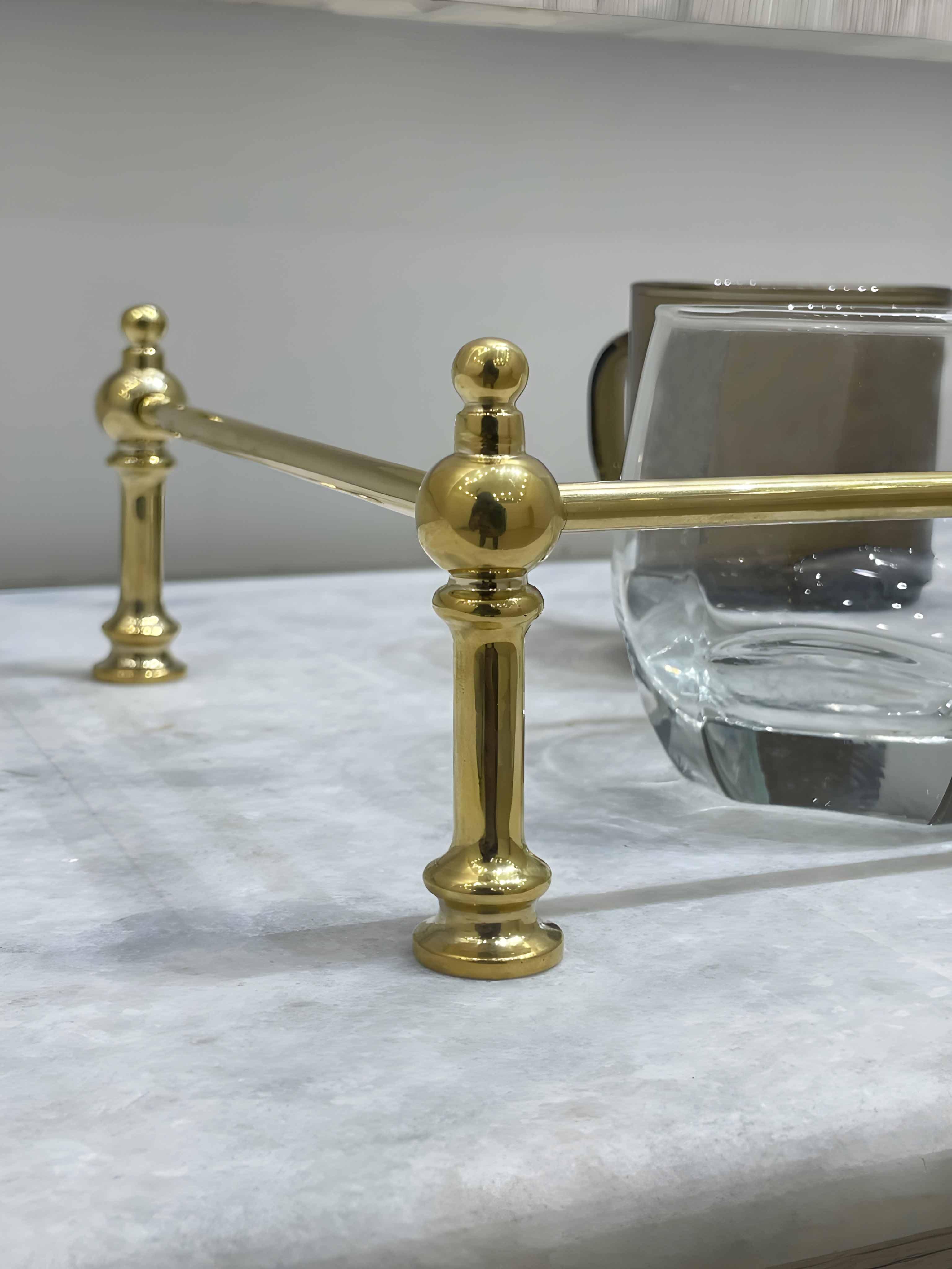 Victorian Brass Gallery Rail with polished brass finish on marble countertop.