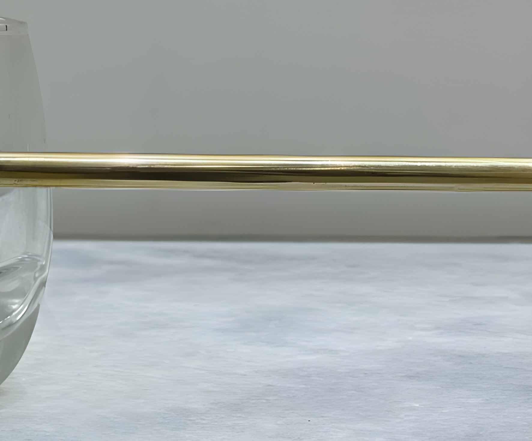 Victorian Brass Gallery Rail - Polished Brass home decor, a shiny brass rod over a clear glass edge.