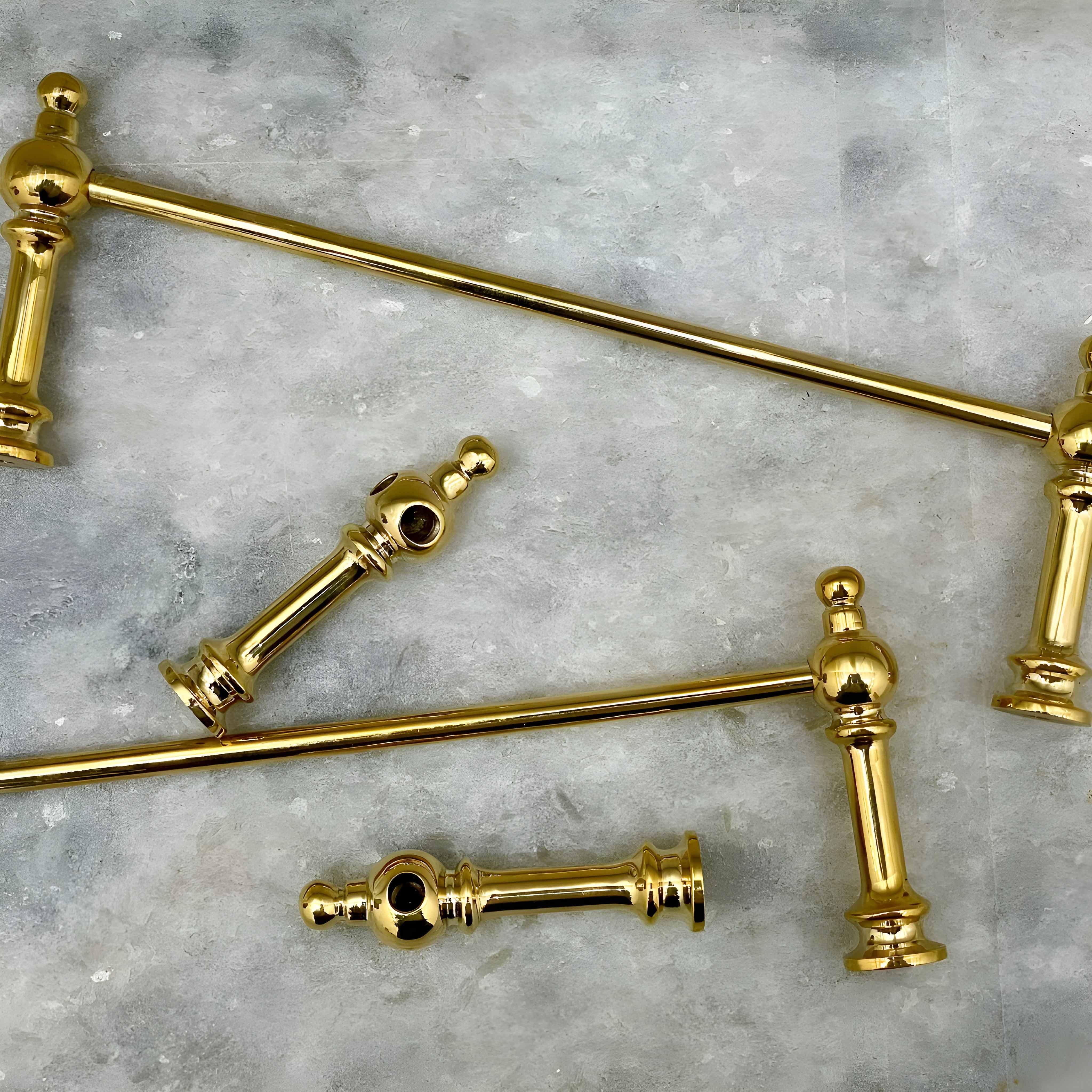 Victorian Brass Gallery Rail in polished brass, laid out on a textured grey background.