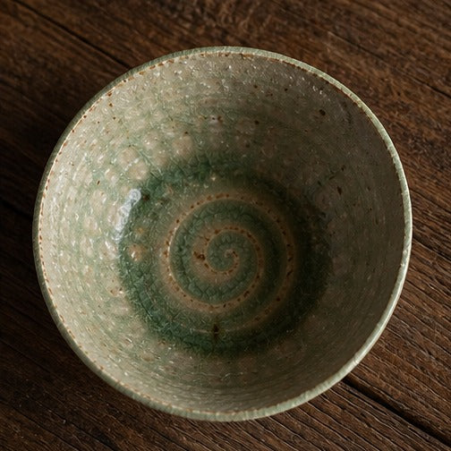 Handmade ancient copper-green glazed ceramic bowl