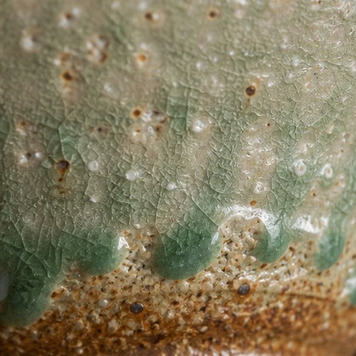 Handmade ancient copper-green glazed ceramic bowl