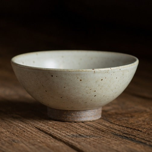Handmade speckled ceramic rice bowl with matching spoon