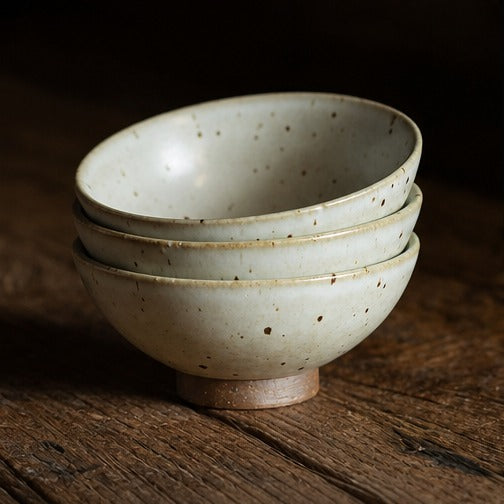 Handmade speckled ceramic rice bowl with matching spoon
