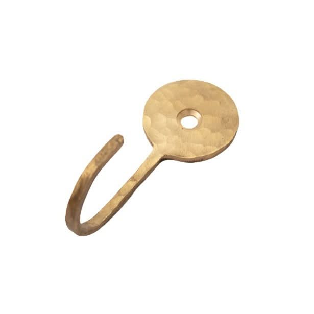 Hammered brass wall hook with circular backplate and curved hook, home decor.
