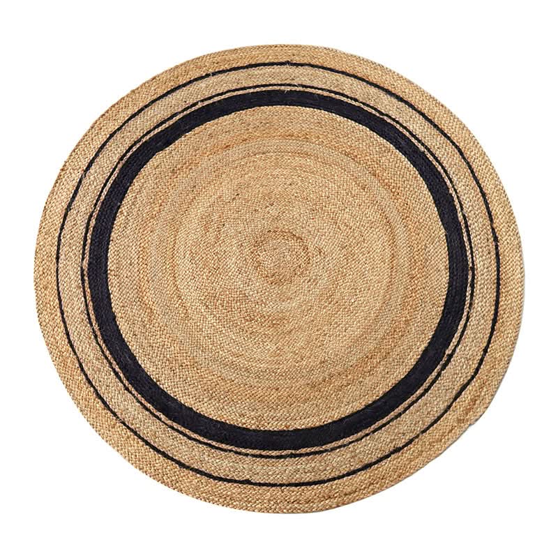 Natural jute round rug with black stripe detail, perfect for home decor.