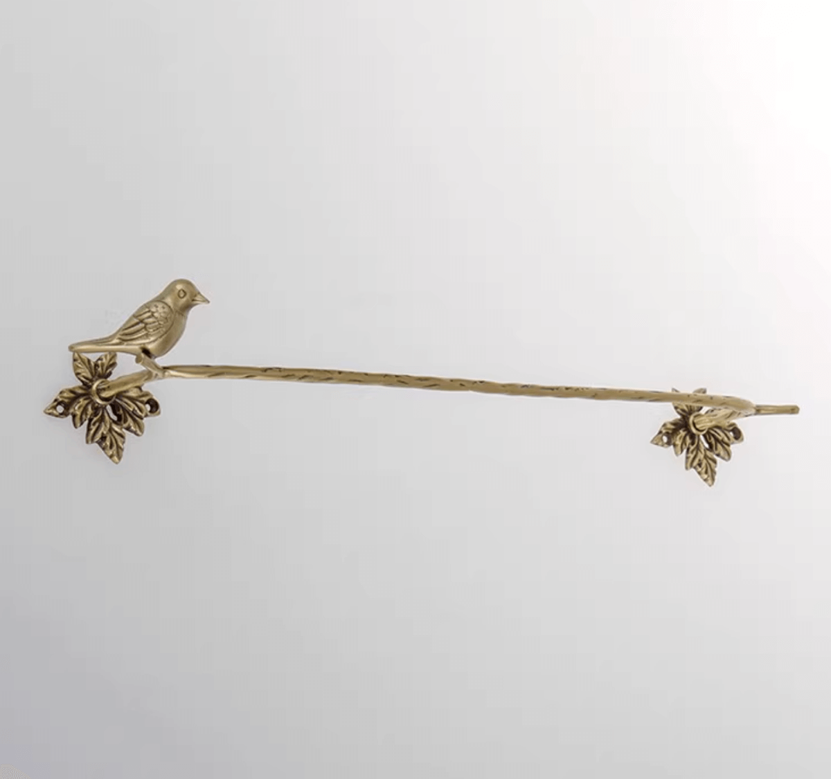 Brass bird towel rack and toilet paper holder. Charming, decorative home decor.