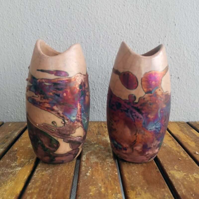 2 ceramic koi vases, copper-toned, unique designs.
