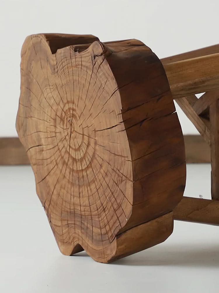 Elm Solid Wood Stool: Natural wood grain and texture on a rustic wooden stool.