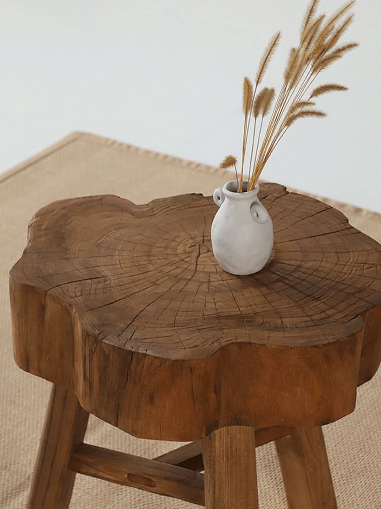 Elm solid wood stool with natural wood grain and a rustic, organic shape, home decor accent.