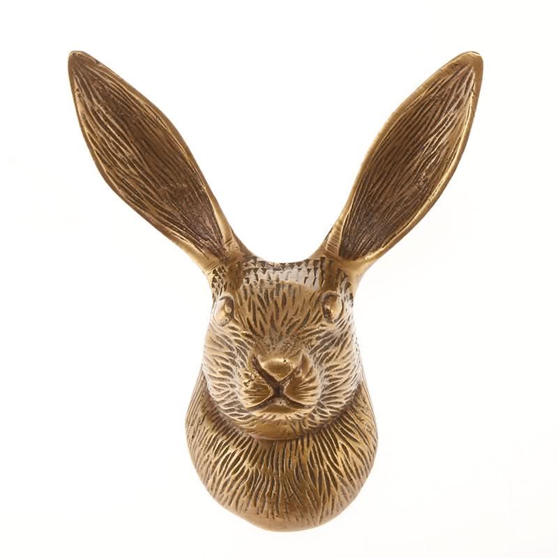 Antique brass hare wall hook for home decor.